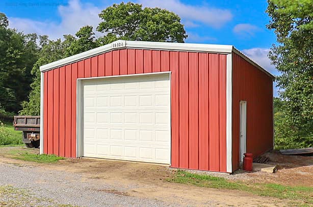 A garage with red wall panels
